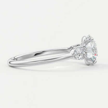 Custom made elysian round three-stone engagement ring with pear side stones | diamond lab