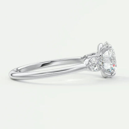 Custom made elysian round three-stone engagement ring with pear side stones | diamond lab
