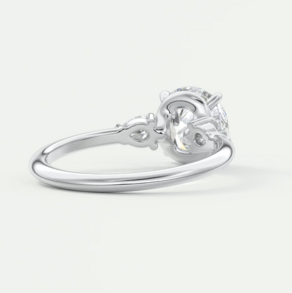 Custom made elysian round three-stone engagement ring with pear side stones | diamond lab