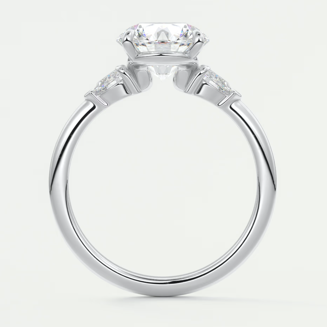 Custom made elysian round three-stone engagement ring with pear side stones | diamond lab