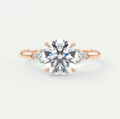 Custom made elysian round three-stone engagement ring with pear side stones | diamond lab