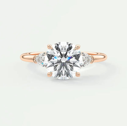 Custom made elysian round three-stone engagement ring with pear side stones | diamond lab
