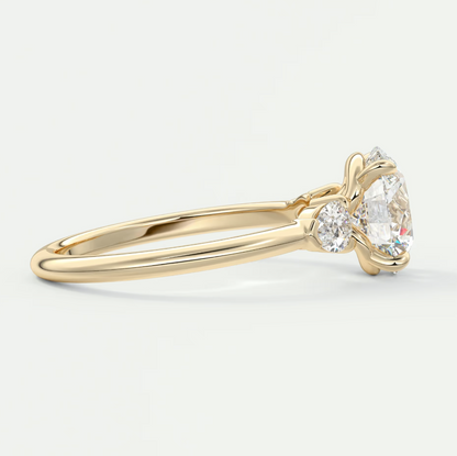 Custom made elysian round three-stone engagement ring with pear side stones | diamond lab