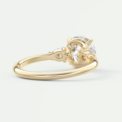 Custom made elysian round three-stone engagement ring with pear side stones | diamond lab