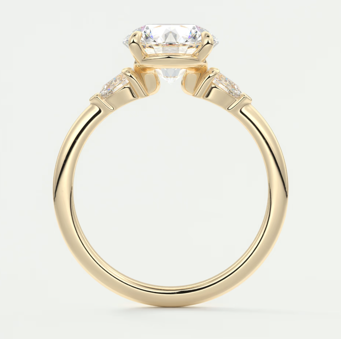 Custom made elysian round three-stone engagement ring with pear side stones | diamond lab