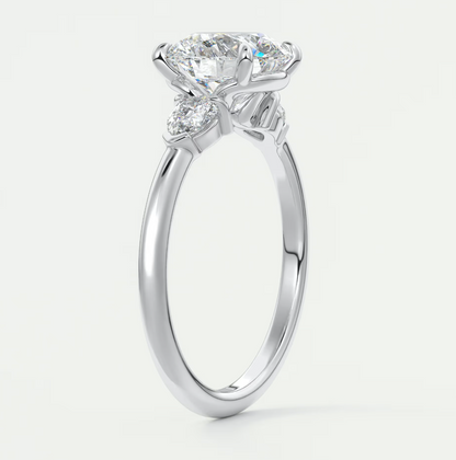 Custom made elysian round three-stone engagement ring with pear side stones | diamond lab