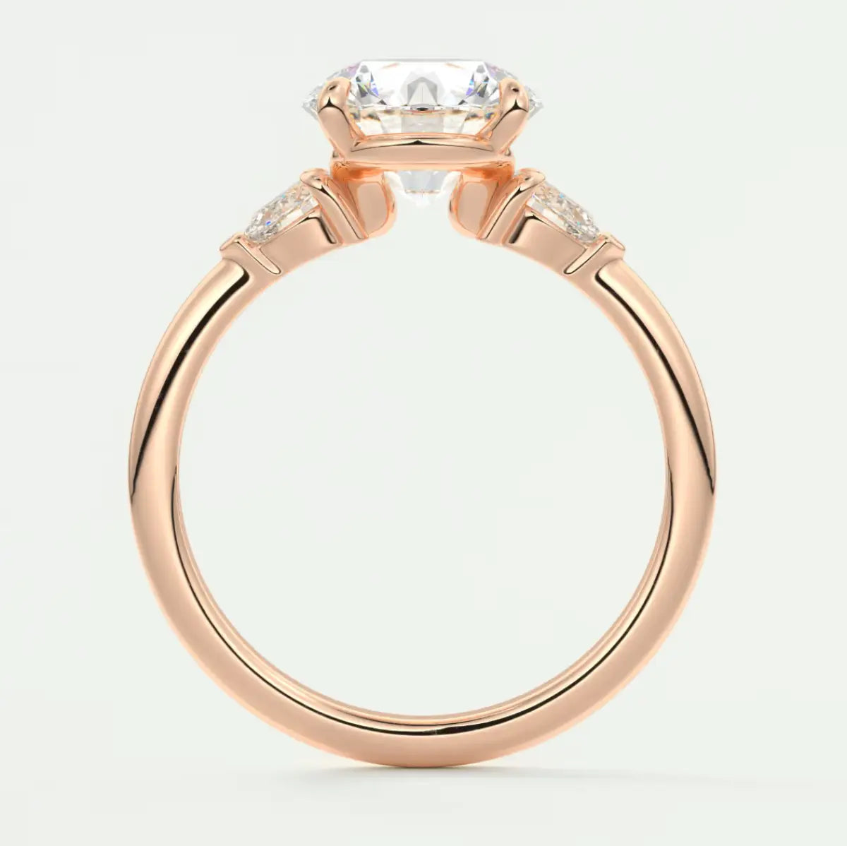 Custom made elysian round three-stone engagement ring with pear side stones | diamond lab