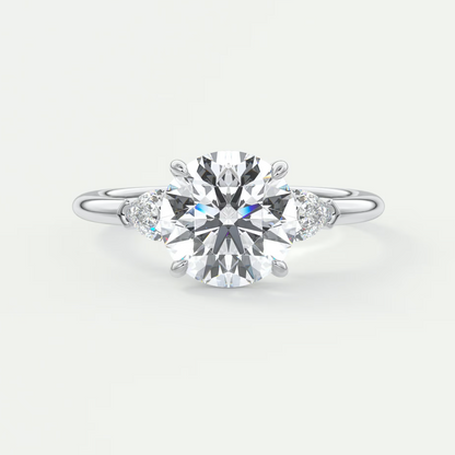 Custom made elysian round three-stone engagement ring with pear side stones | diamond lab