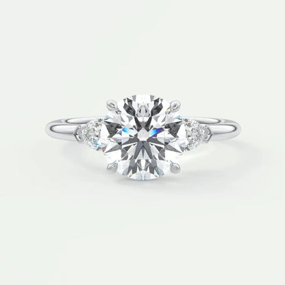 Custom made elysian round three-stone engagement ring with pear side stones | diamond lab