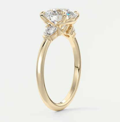Custom made elysian round three-stone engagement ring with pear side stones | diamond lab