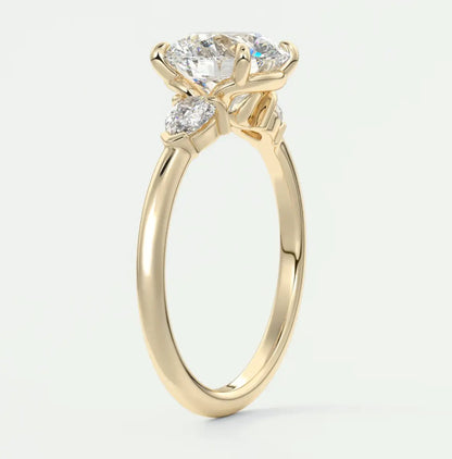 Custom made elysian round three-stone engagement ring with pear side stones | diamond lab