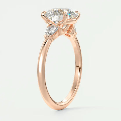 Custom made elysian round three-stone engagement ring with pear side stones | diamond lab