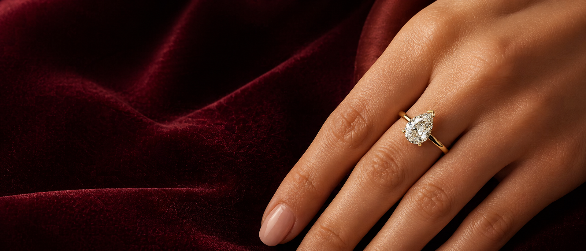 Diamond ring on a hand with a dark background