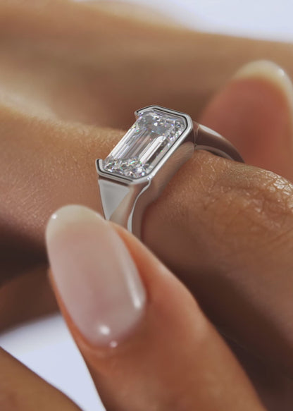 Lyra – East-West Half Bezel Emerald Engagement Ring