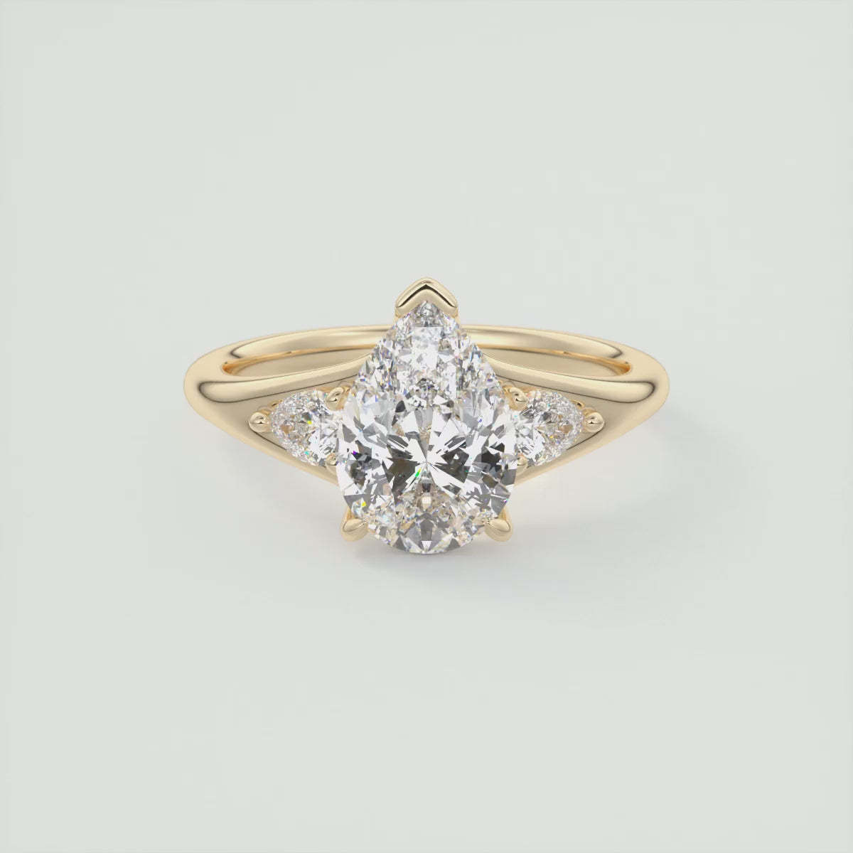 Load video: Solena Pear Three-Stone Split Shank Engagement Ring