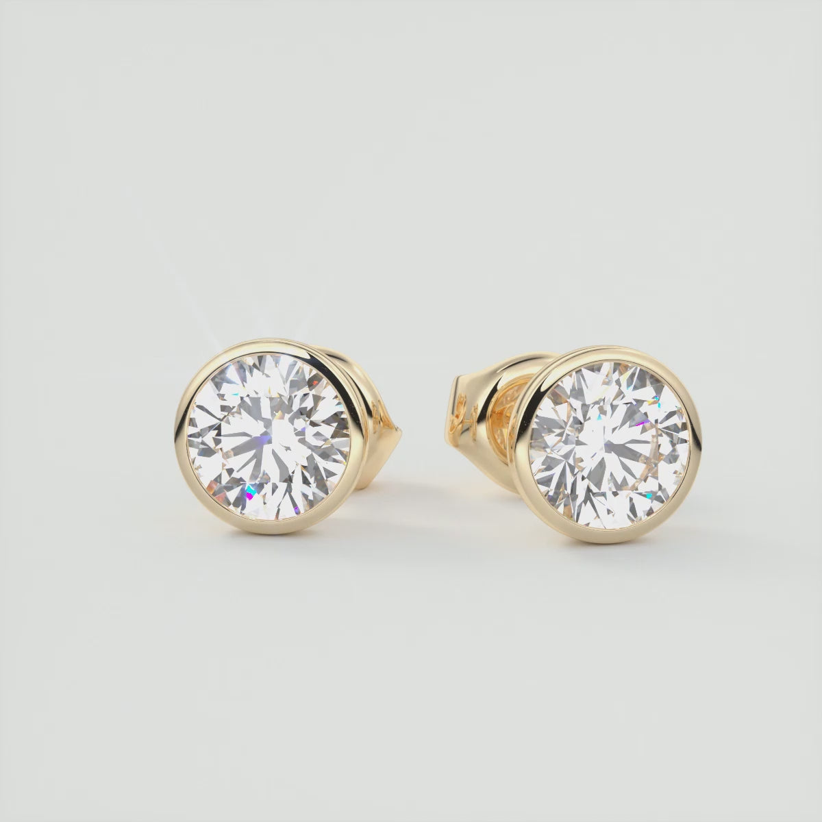 Load video: Timeless Round Bezel Stud Earrings | Lab Diamond or Moissanite