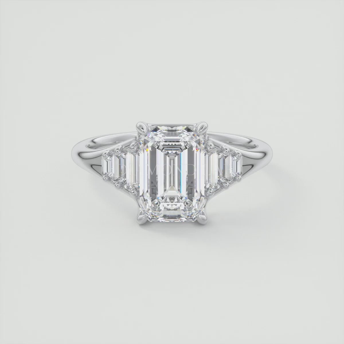 Solena Emerald Split Shank Engagement Ring with Graduated Baguette Side Stones