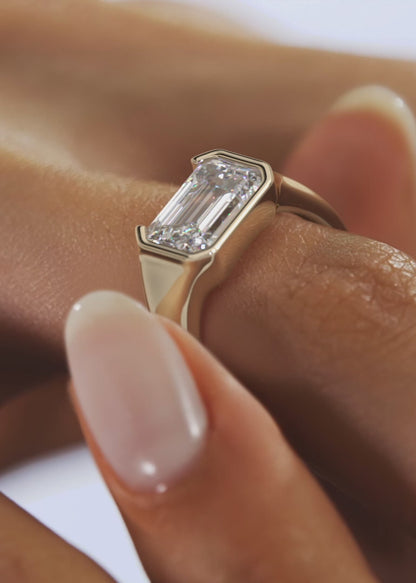 Lyra – East-West Half Bezel Emerald Engagement Ring