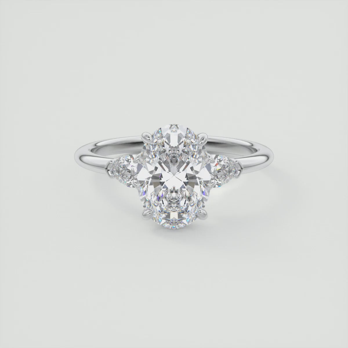 Elysian Oval with Pear Three-Stone Engagement Ring – Lab Diamond or Moissanite