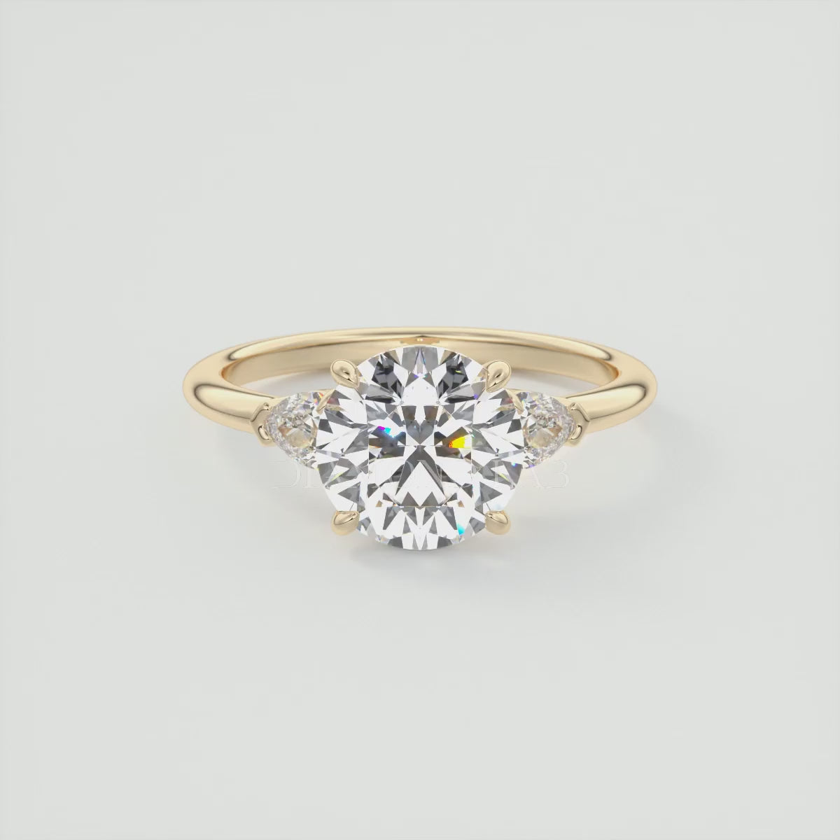 Load video: Elysian Round Three-Stone Engagement Ring with Pear Side Stones