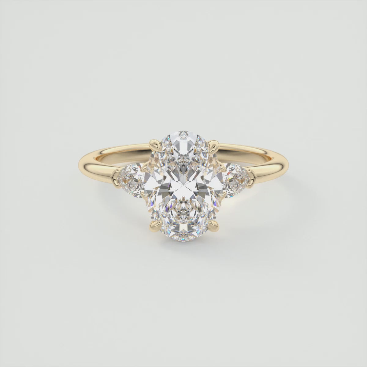 Load video: Elysian Oval with Pear Three-Stone Engagement Ring – Lab Diamond or Moissanite