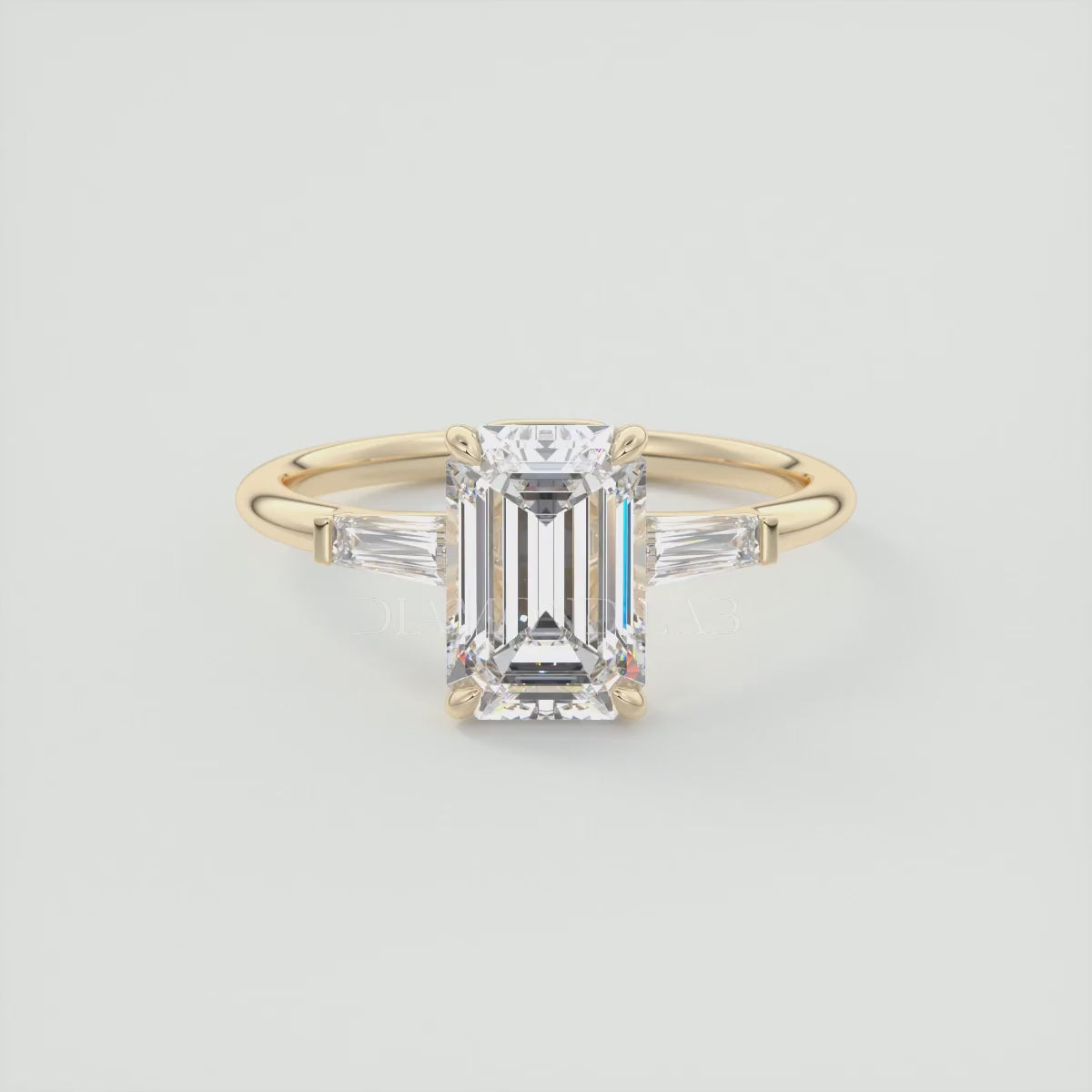 Load video: Elysian Emerald Three-Stone Engagement Ring with Tapered Baguettes