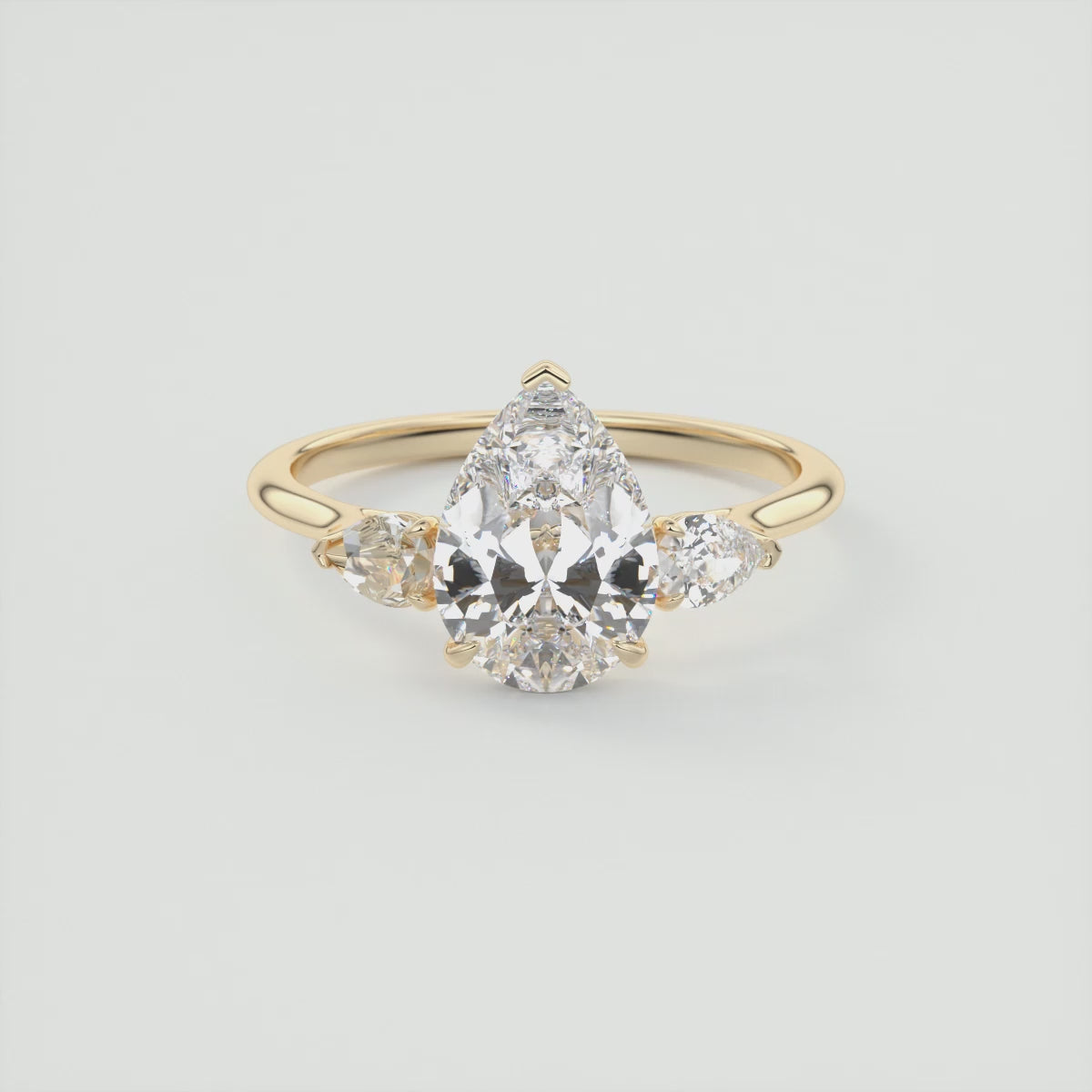 Load video: Amara Pear Three-Stone Engagement Ring – Lab Diamond or Moissanite