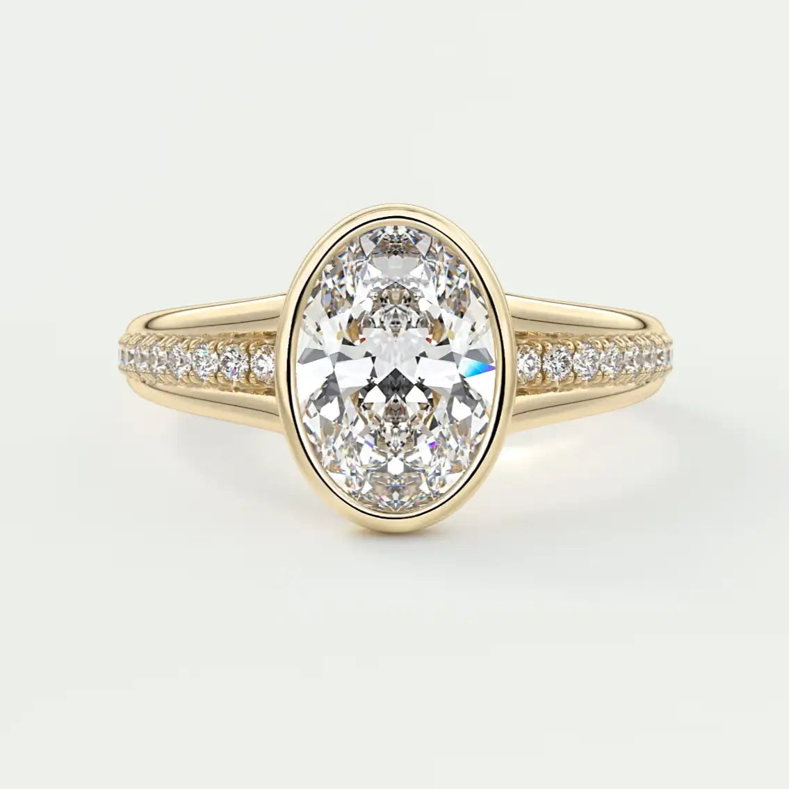 Gold ring with a large diamond and smaller diamonds on the band against a white background
