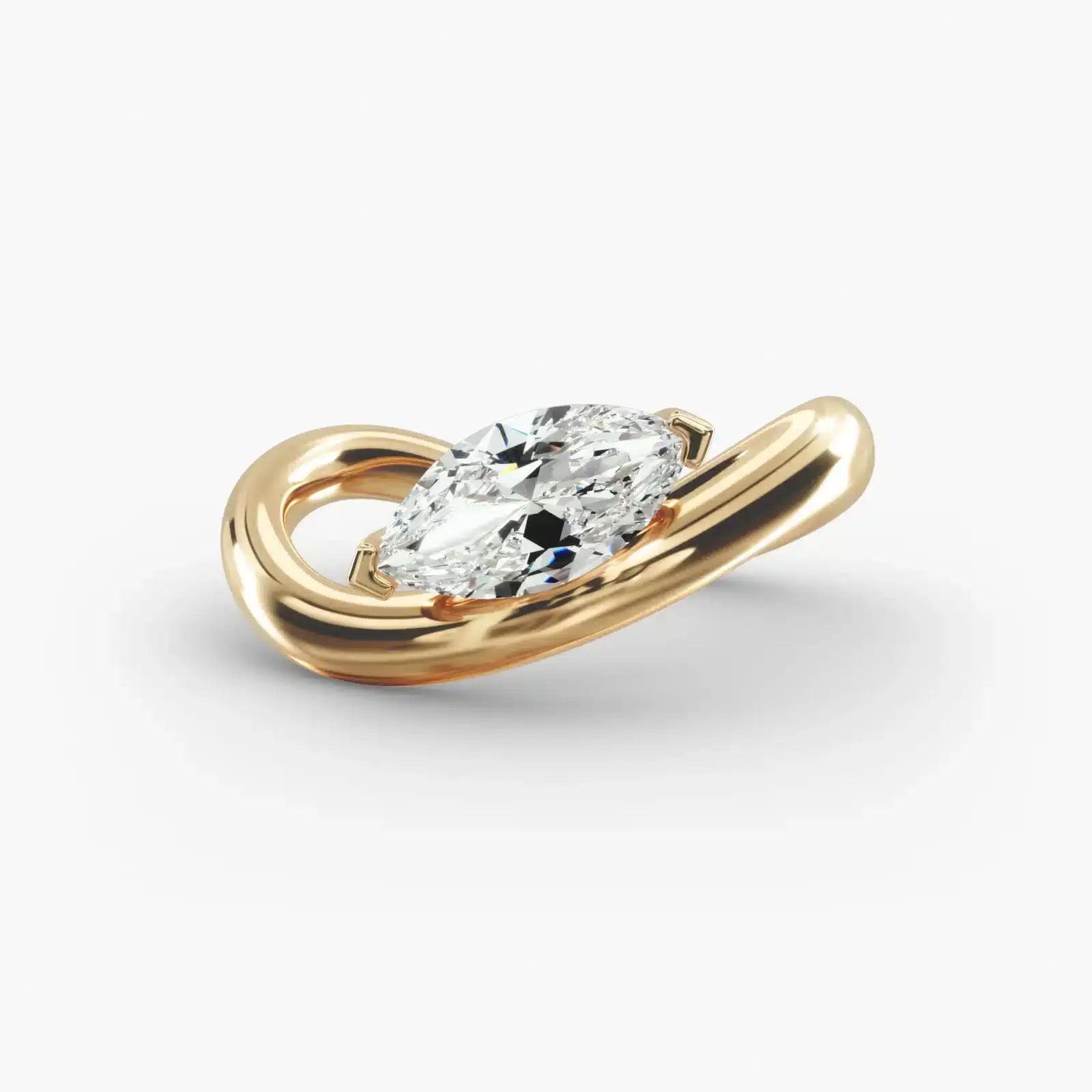 Gold ring with a diamond on a light gray background