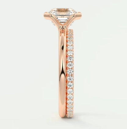 18k rose gold engagement ring with princess cut diamond and pavé side stones.