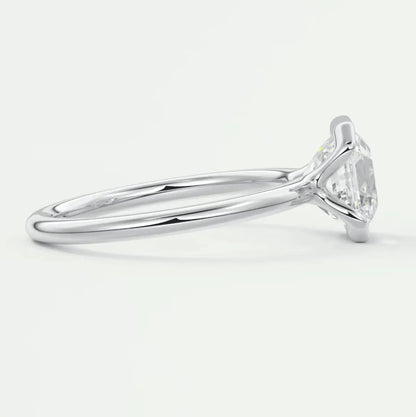 18k white gold engagement ring with a round diamond.