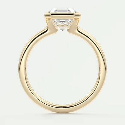18-karat yellow gold engagement ring with a princess-cut diamond.
