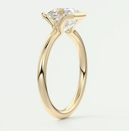 18k yellow gold engagement ring with a princess cut diamond.