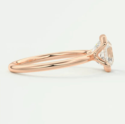 18k rose gold engagement ring with a marquise-cut diamond.