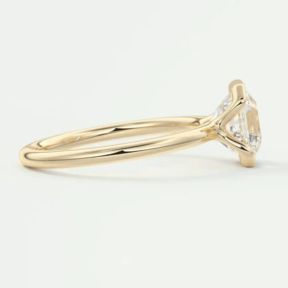 18k yellow gold solitaire diamond engagement ring with a marquise-cut stone.