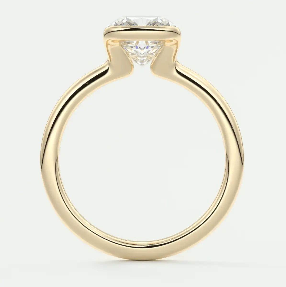 18-karat yellow gold solitaire diamond engagement ring.