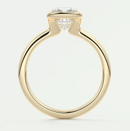 18-karat yellow gold solitaire diamond engagement ring.