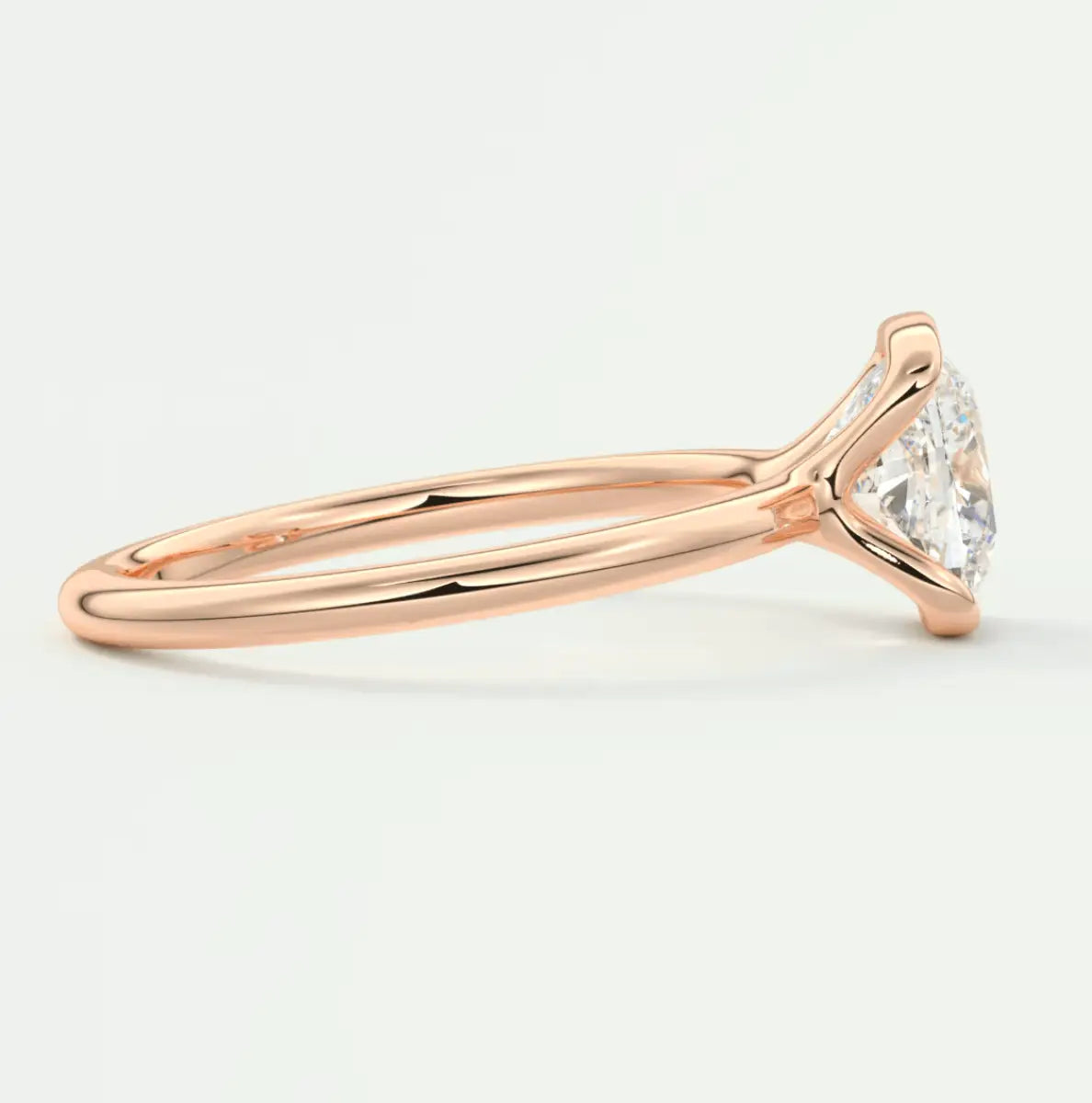 18-karat rose gold engagement ring with a marquise-cut diamond.
