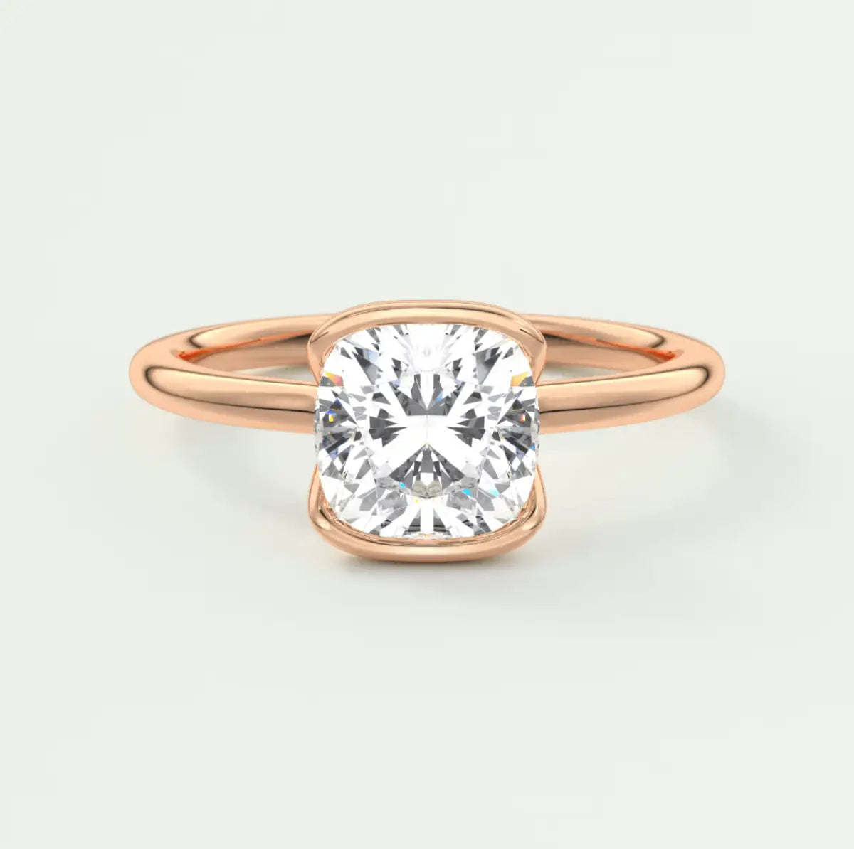 Rose gold cushion-cut diamond engagement ring with a solitaire design.