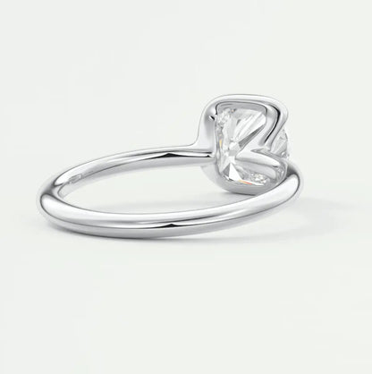 Silver heart-shaped diamond engagement ring with a solitaire setting.