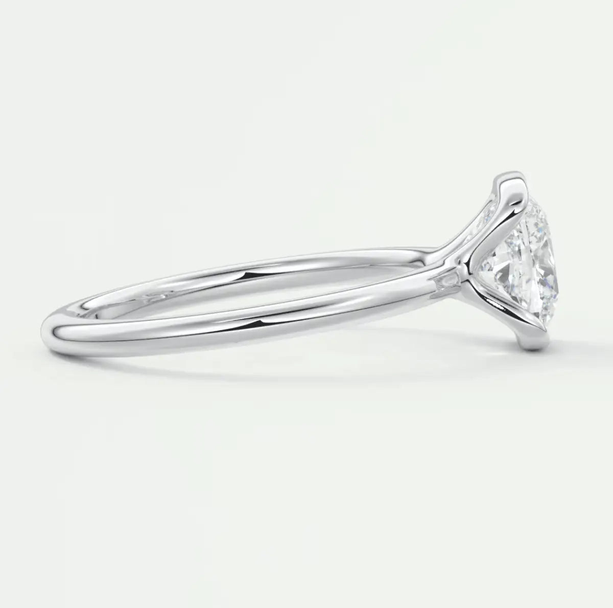 18k white gold engagement ring with a marquise-cut diamond.
