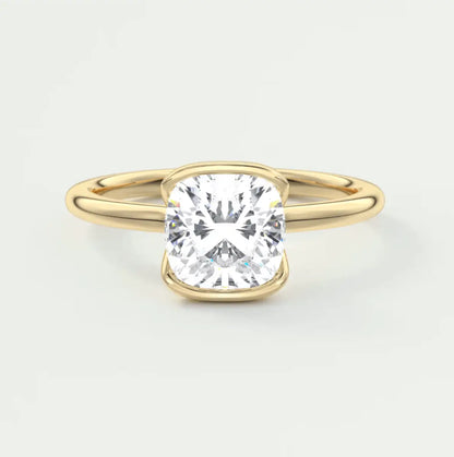 Cushion-cut diamond engagement ring with yellow gold band, featuring a princess cut gemstone.