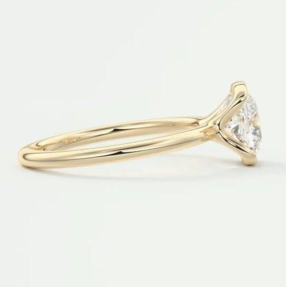 18k yellow gold engagement ring with a marquise-cut diamond.