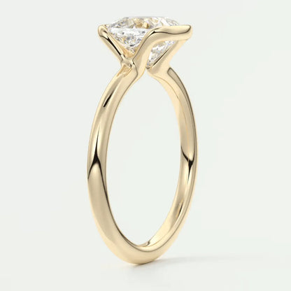18k yellow gold engagement ring with a princess cut diamond.