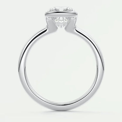 18k white gold engagement ring with a round diamond center stone.