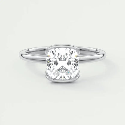 Cushion-cut diamond engagement ring with a white gold band.