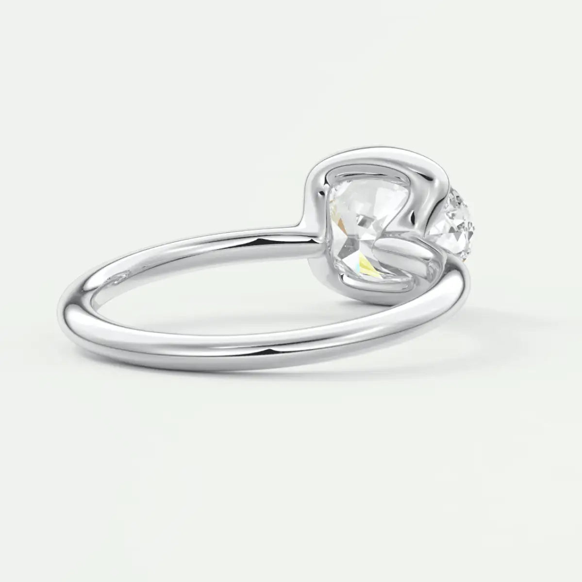 Silver heart-shaped diamond engagement ring with a single stone set in prongs.