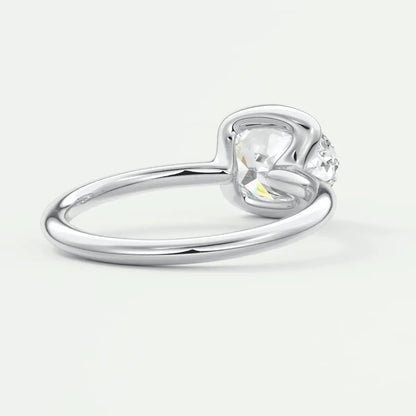 Silver heart-shaped diamond engagement ring with a single stone set in prongs.