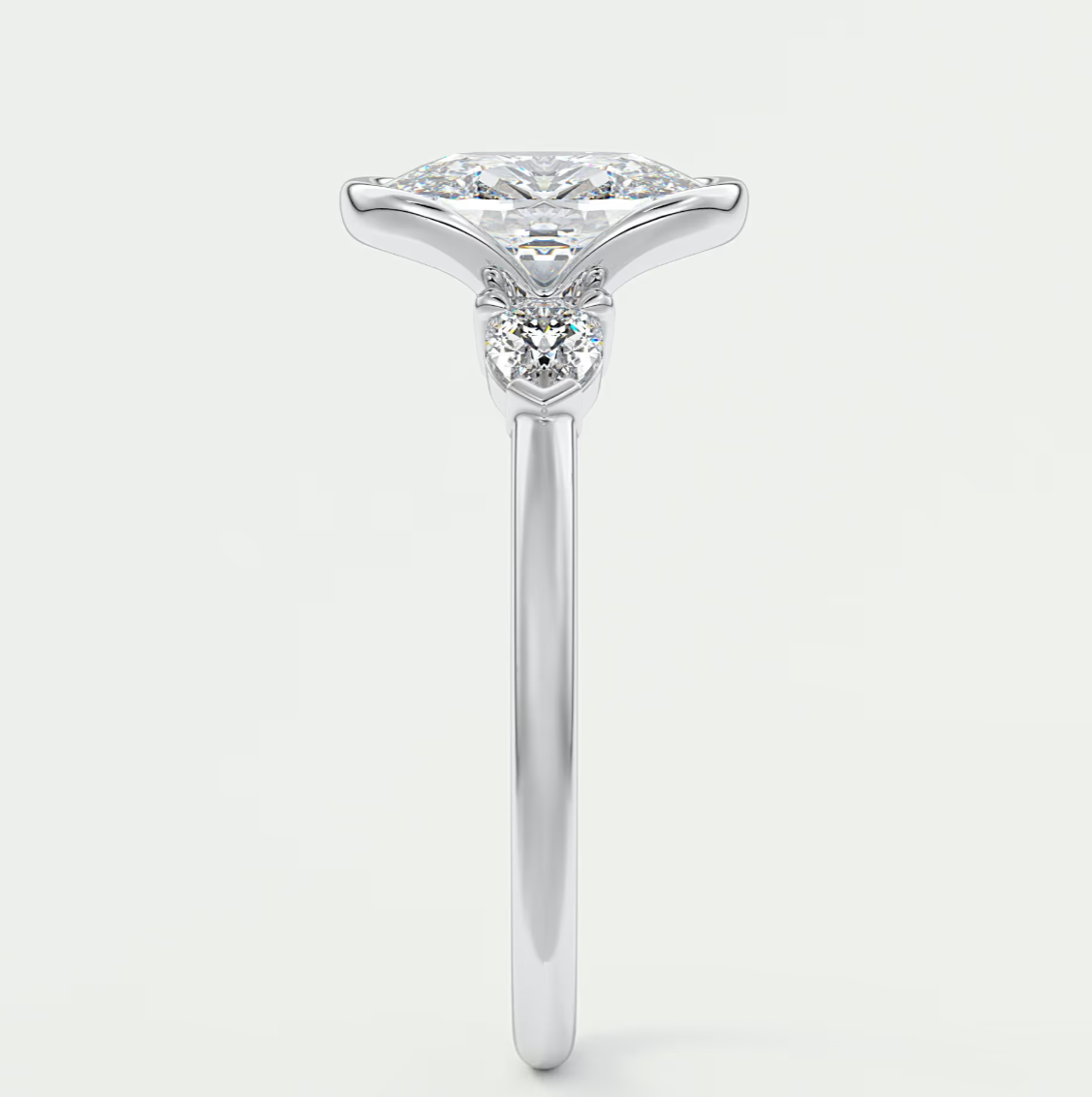 Custom made solara elongated cushion half bezel three-stone engagement ring | diamond lab