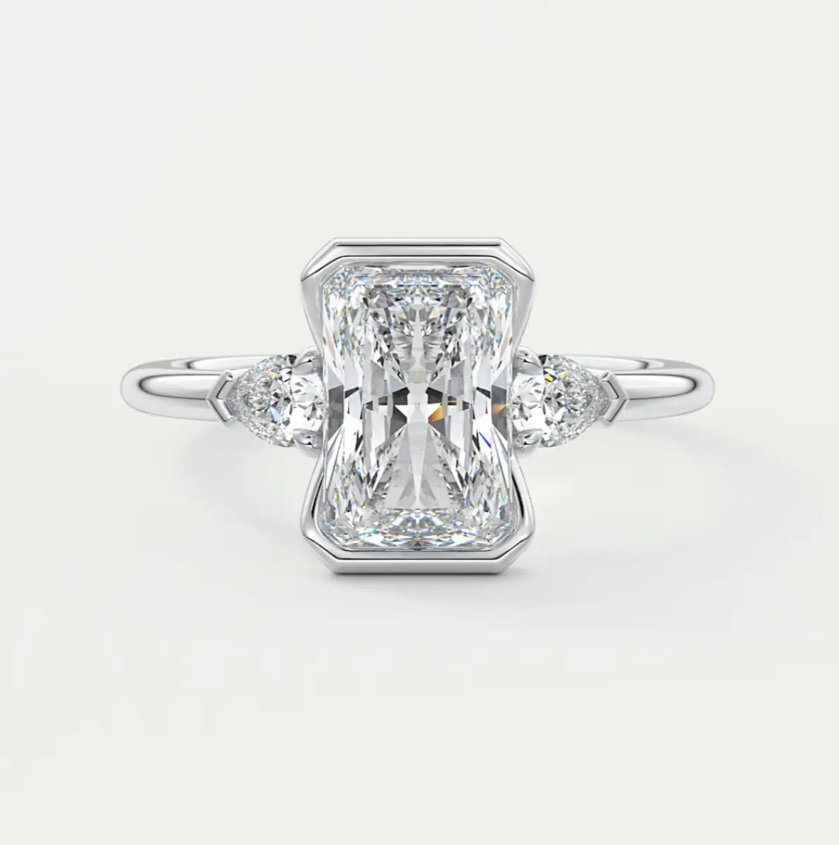 Custom made solara elongated radiant half bezel three-stone engagement ring | diamond lab